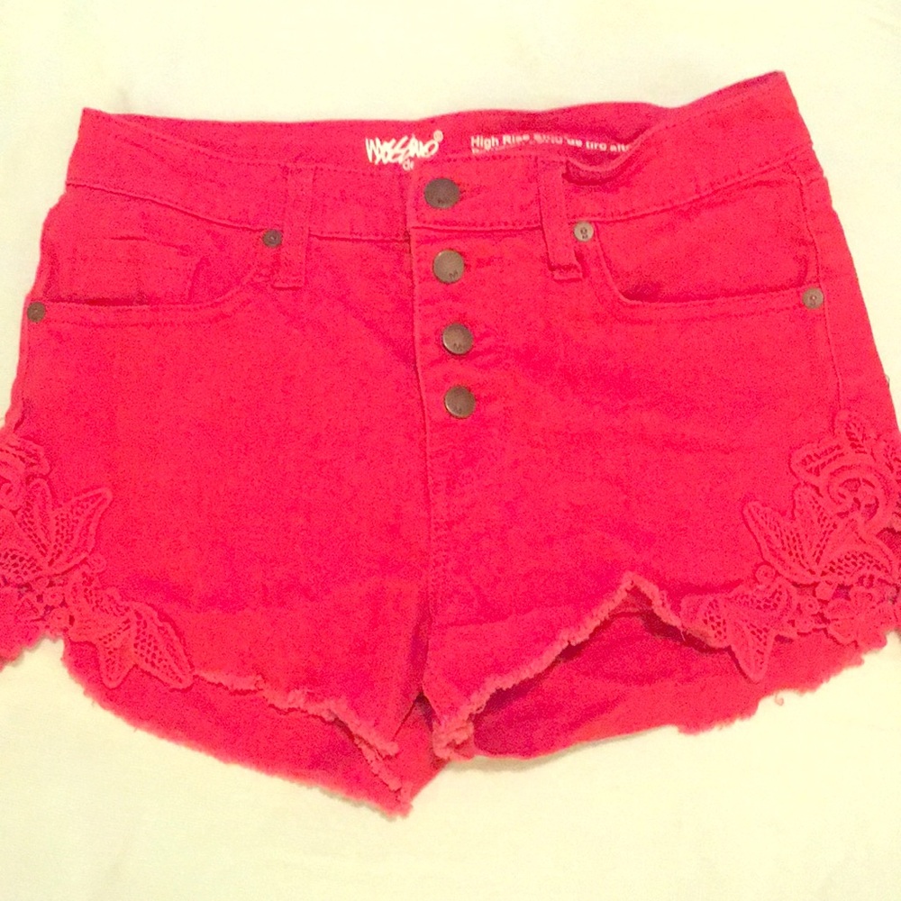 Red shorts with red lace cutout detail